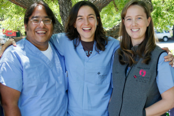 three medical professionals smiling