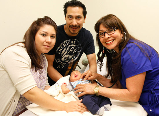 parents and nurse caring for infant